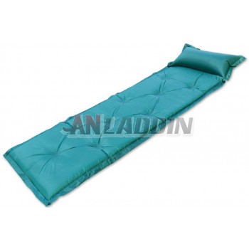 Self-inflating camping mat with pillow