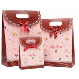 Bow clamshell gift bag